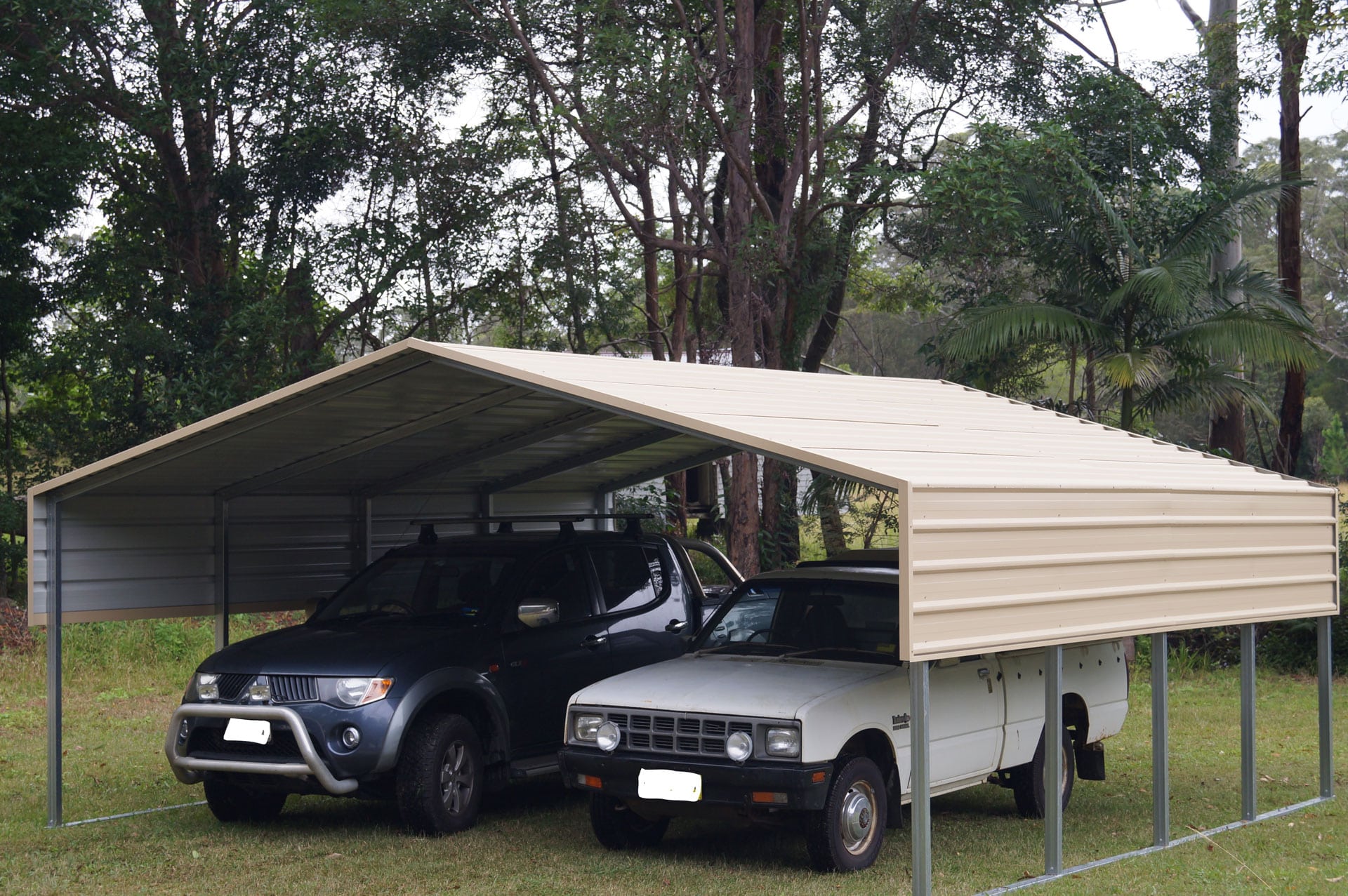 Double carport shelter with side walls.
