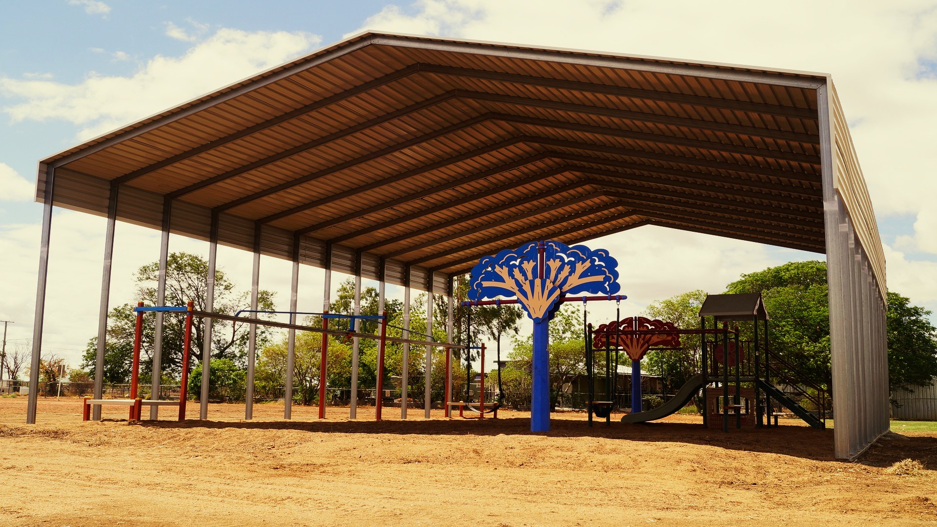 An industrial size shade shed over a playground.