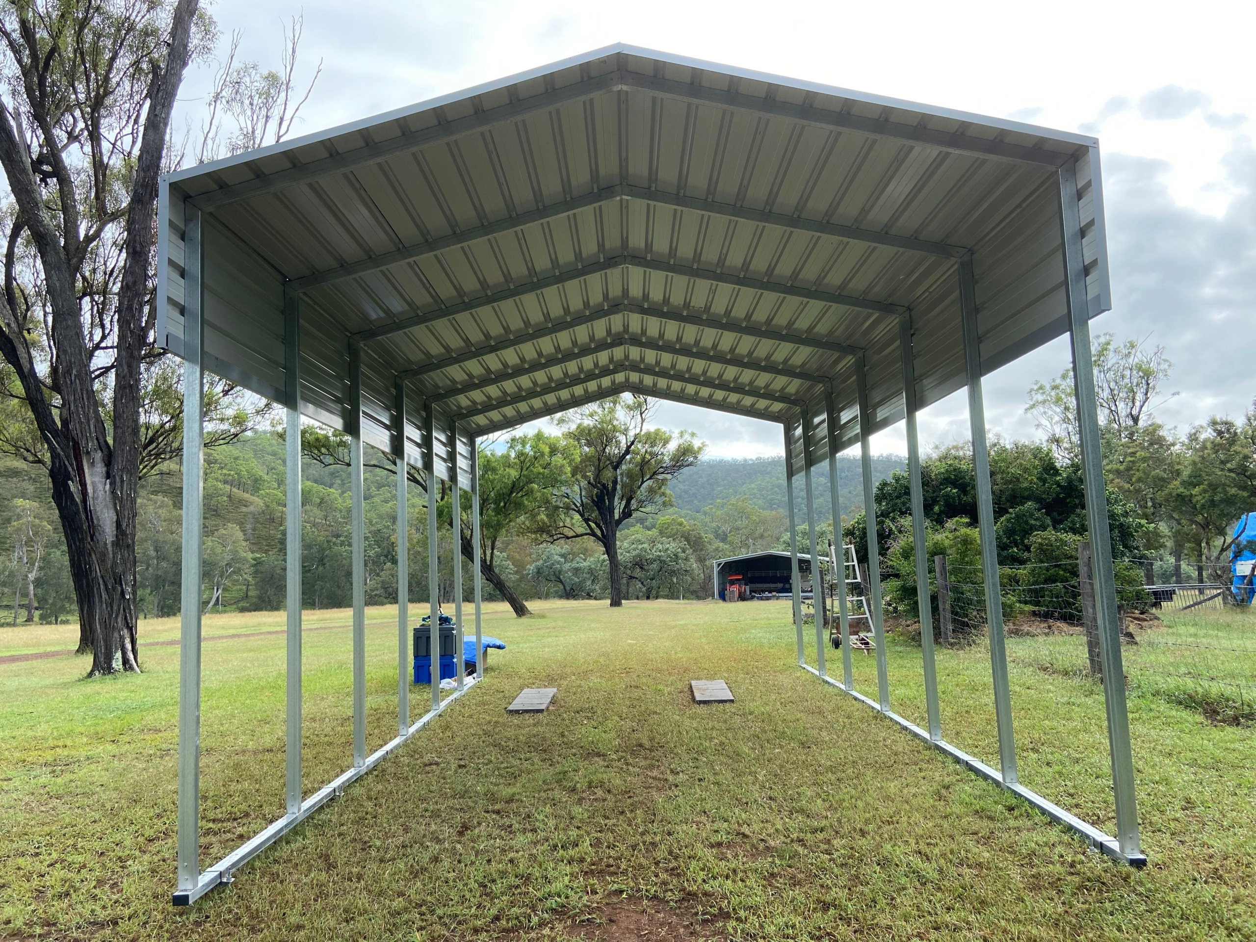 a metal structure on grass