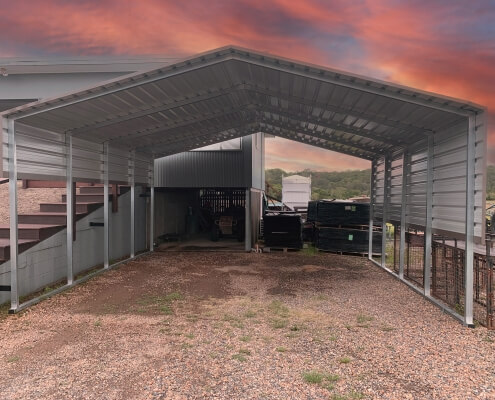 a metal shed with a roof