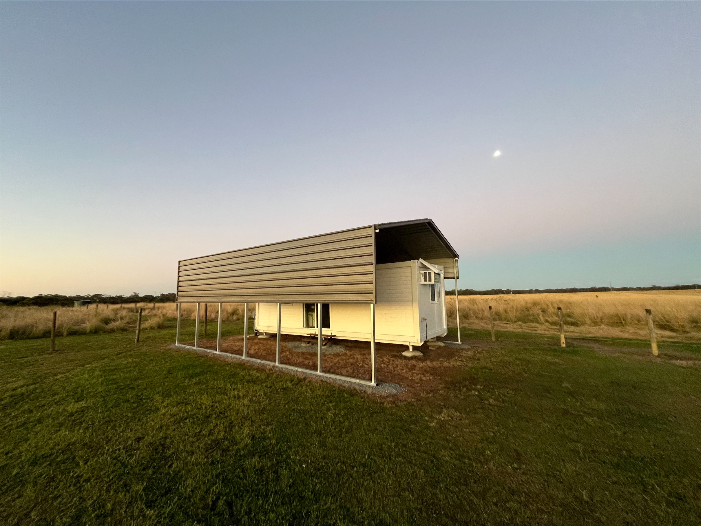a small house in a field