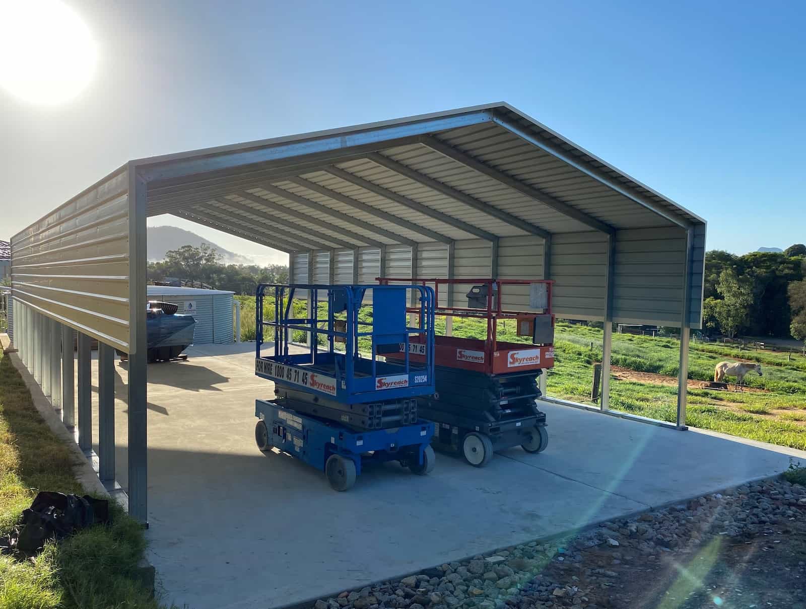 Steel rural shed installed on concrete slab.