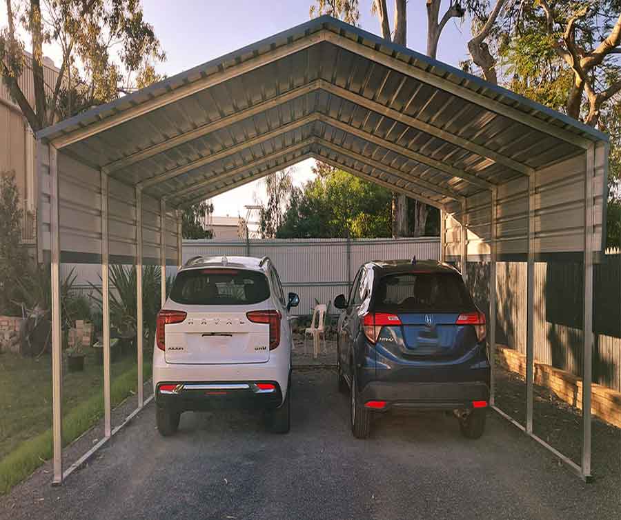Two cars under a metal shelter