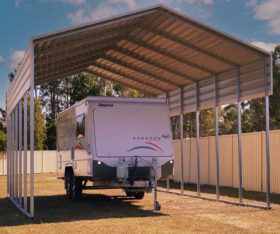 Caravan under metal shelter outdoors