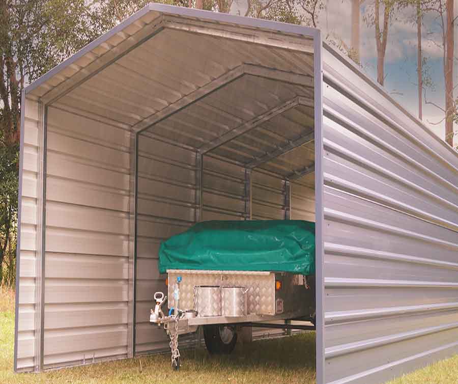 Metal shelter with covered trailer inside